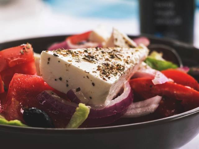 Ingredients and preparation for horiatiki greek salad