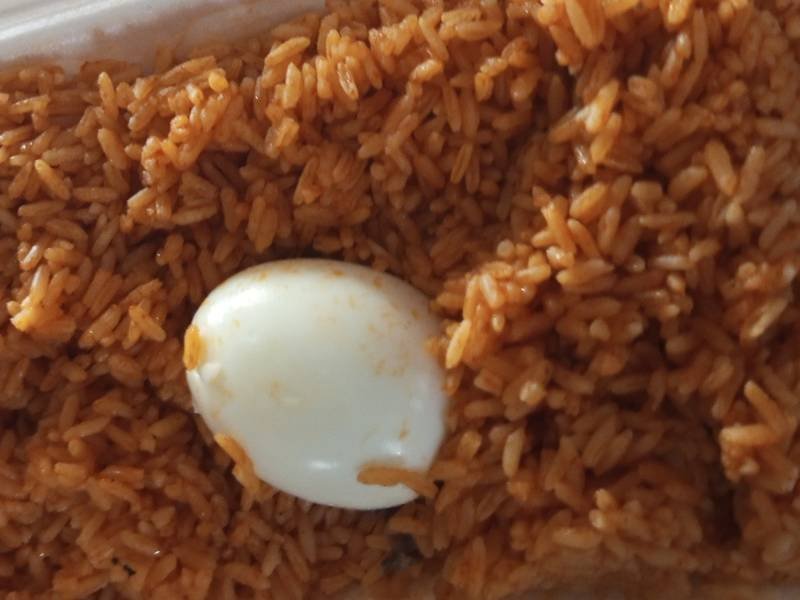 Jollof Rice — Nigerian dinner recipe, served and ready to eat