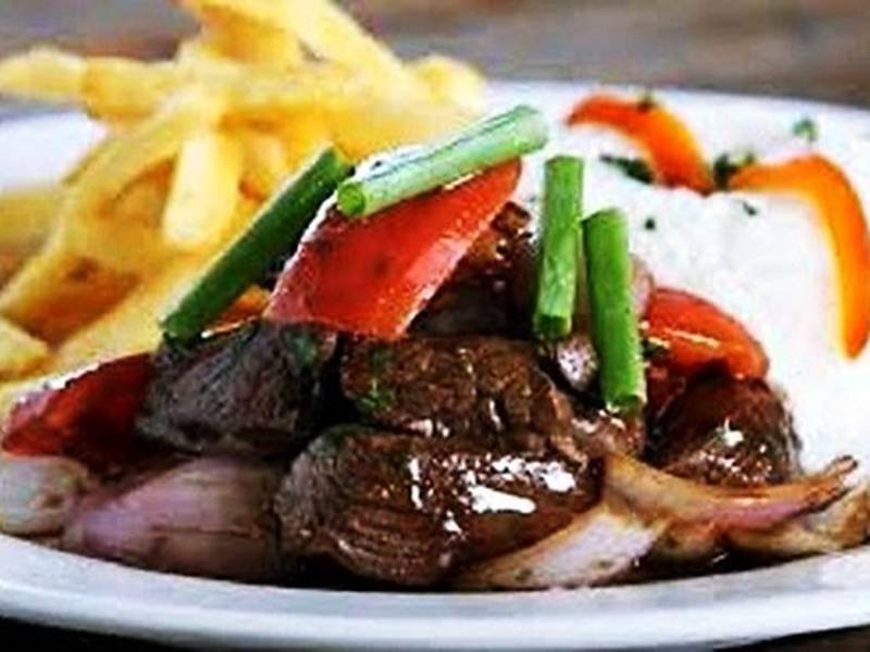 Lomo Saltado — Peruvian dinner recipe, served and ready to eat