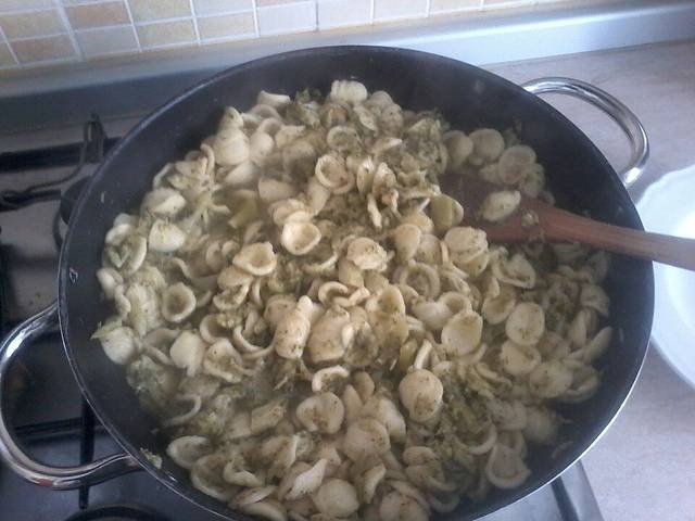 Ingredients and preparation for orecchiette con cime di rapa