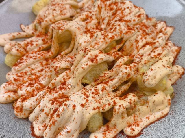 Ingredients and preparation for patatas bravas