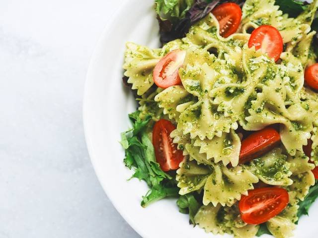 Ingredients and preparation for pesto pasta